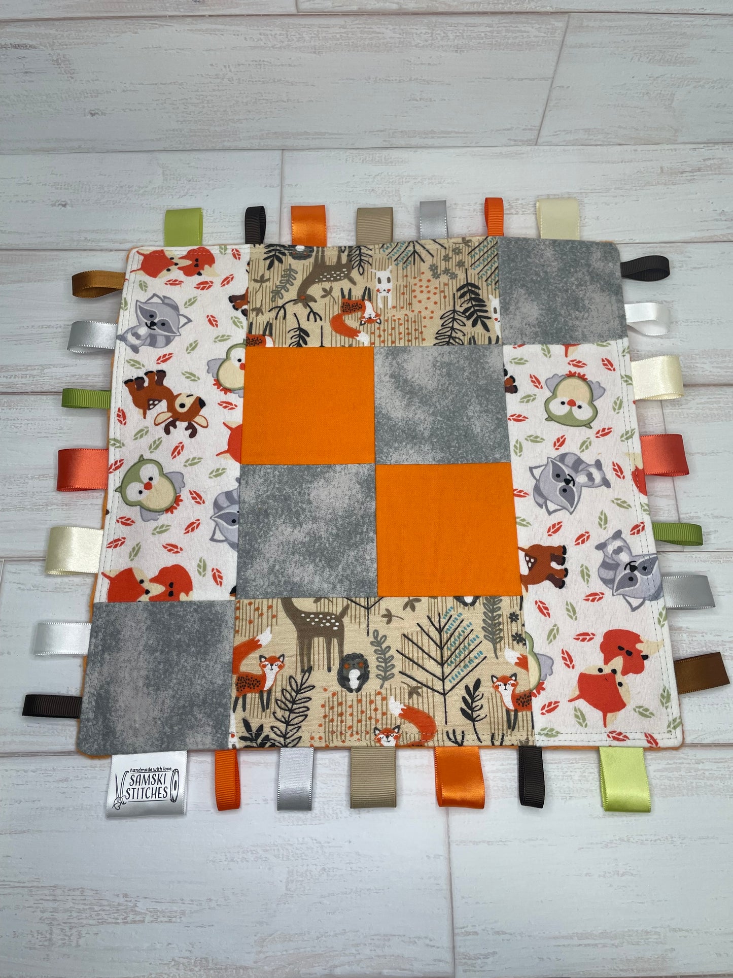 Woodlands Orange Grey Checkered Quilted Sensory Taglet