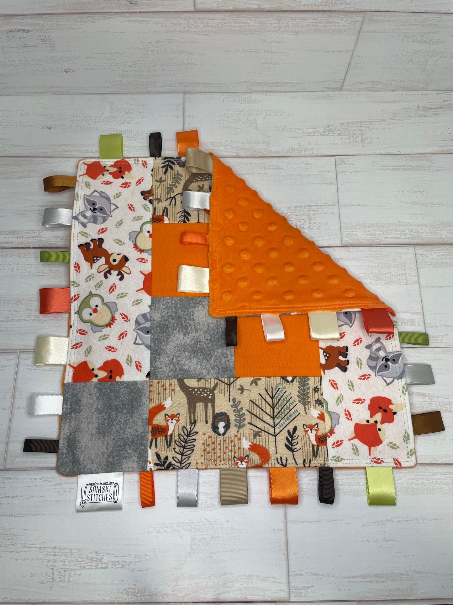 Woodlands Orange Grey Checkered Quilted Sensory Taglet