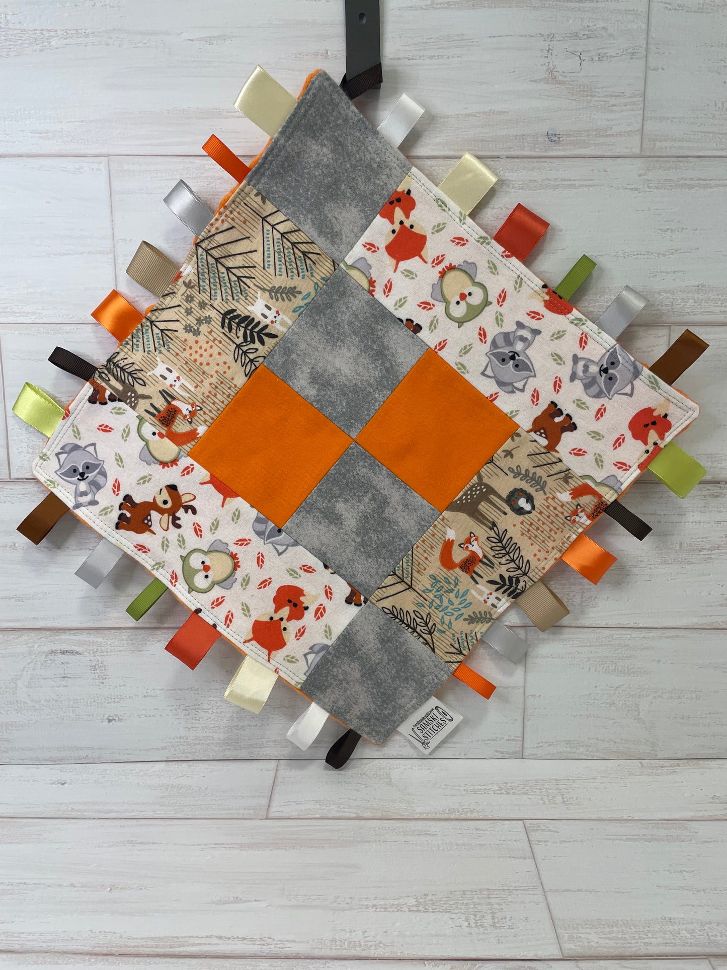 Woodlands Orange Grey Checkered Quilted Sensory Taglet