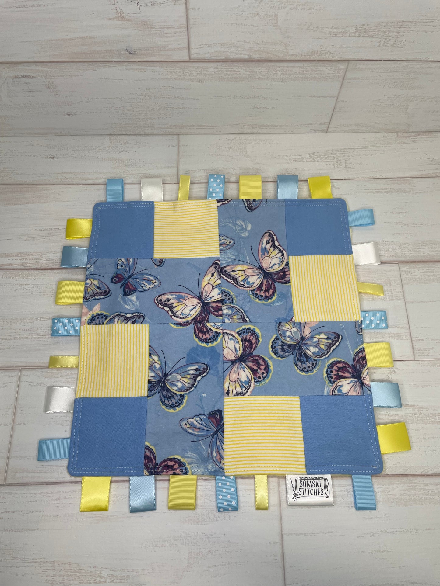 Butterflies on Light Blue with Yellow Accents Sensory Taglet