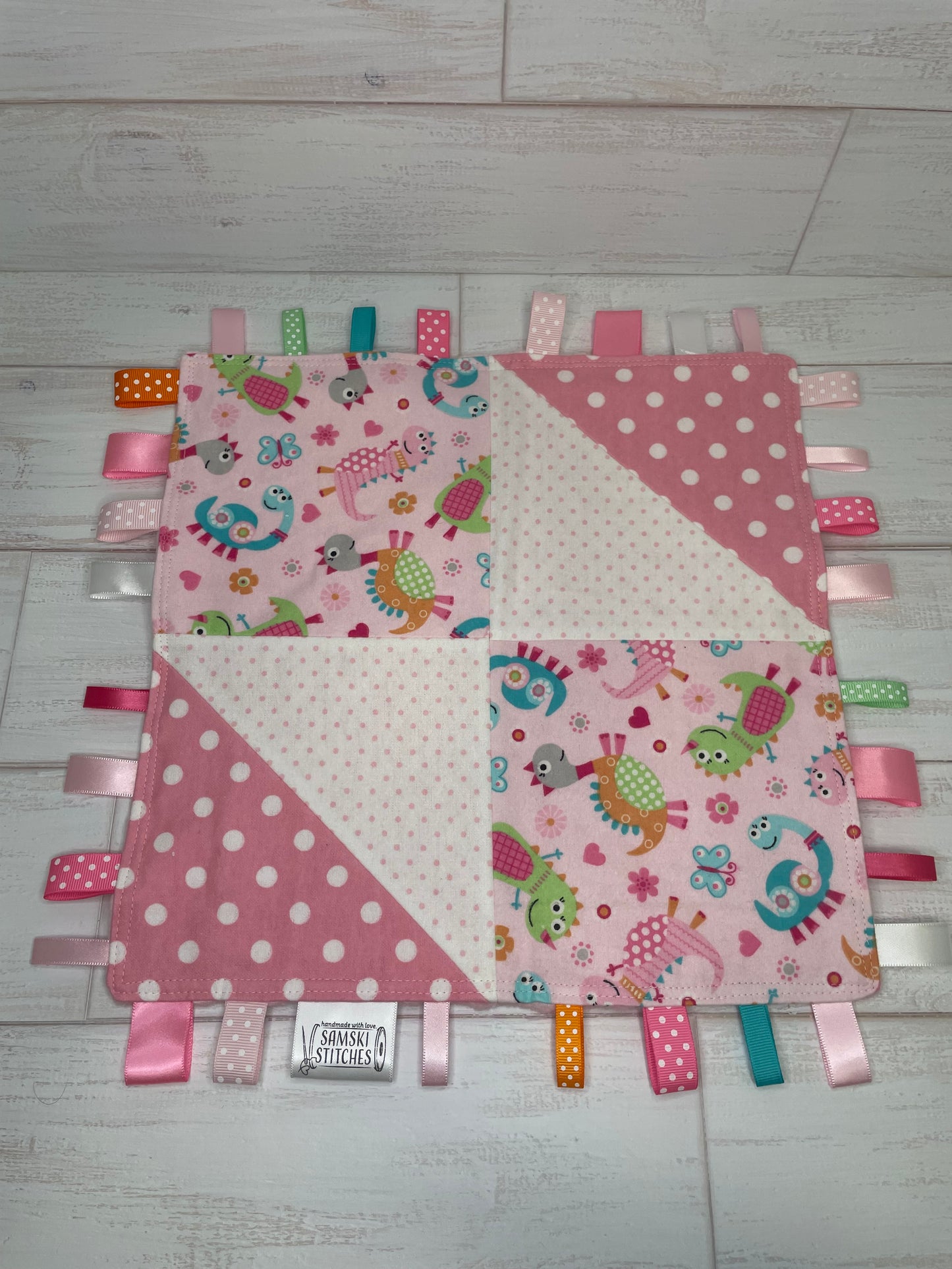 Dinosaurs on Pink with Multi Dots Sensory Taggie