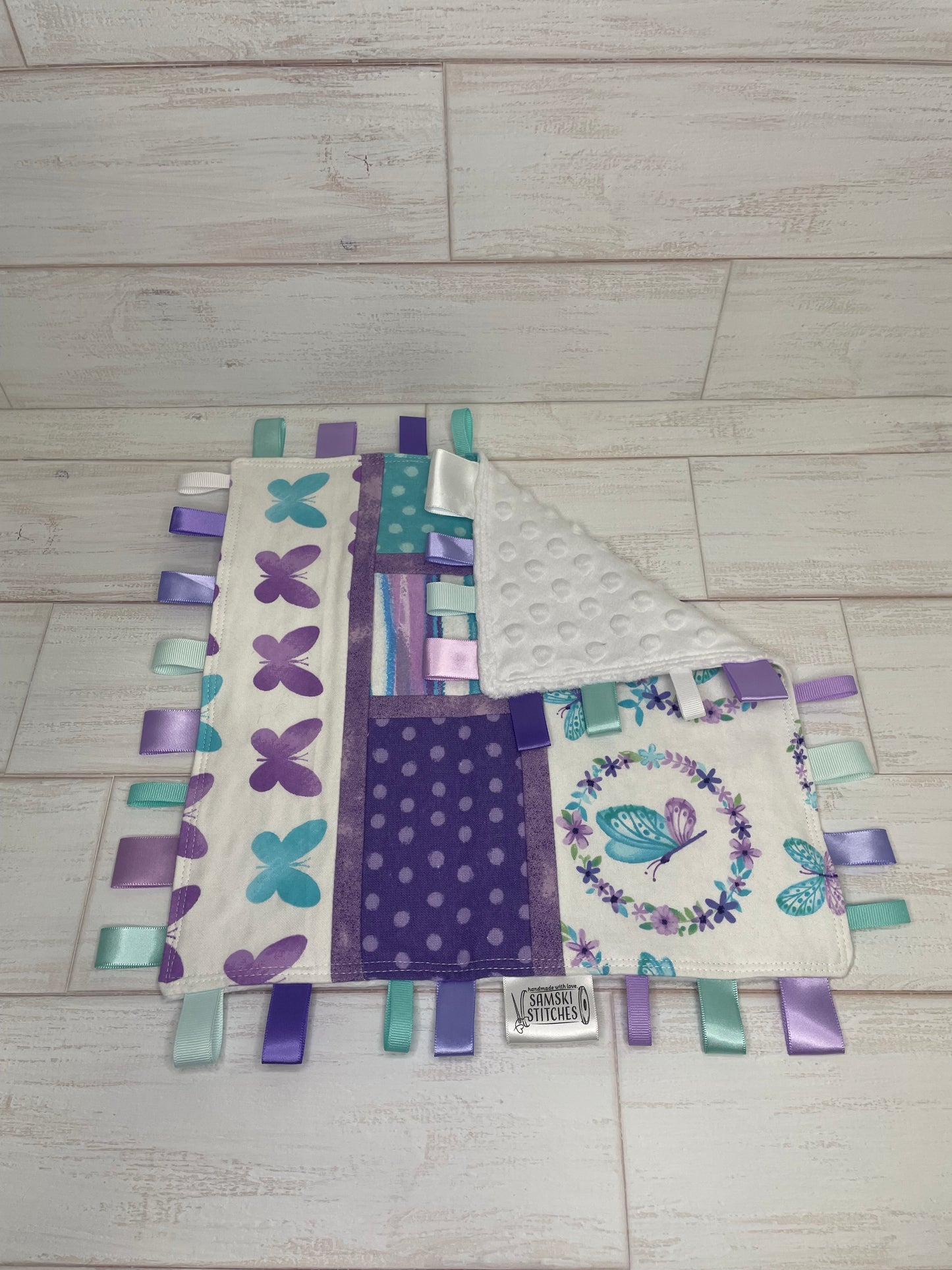 Butterflies on White with Turquoise and Purple Accents Sensory Taglet