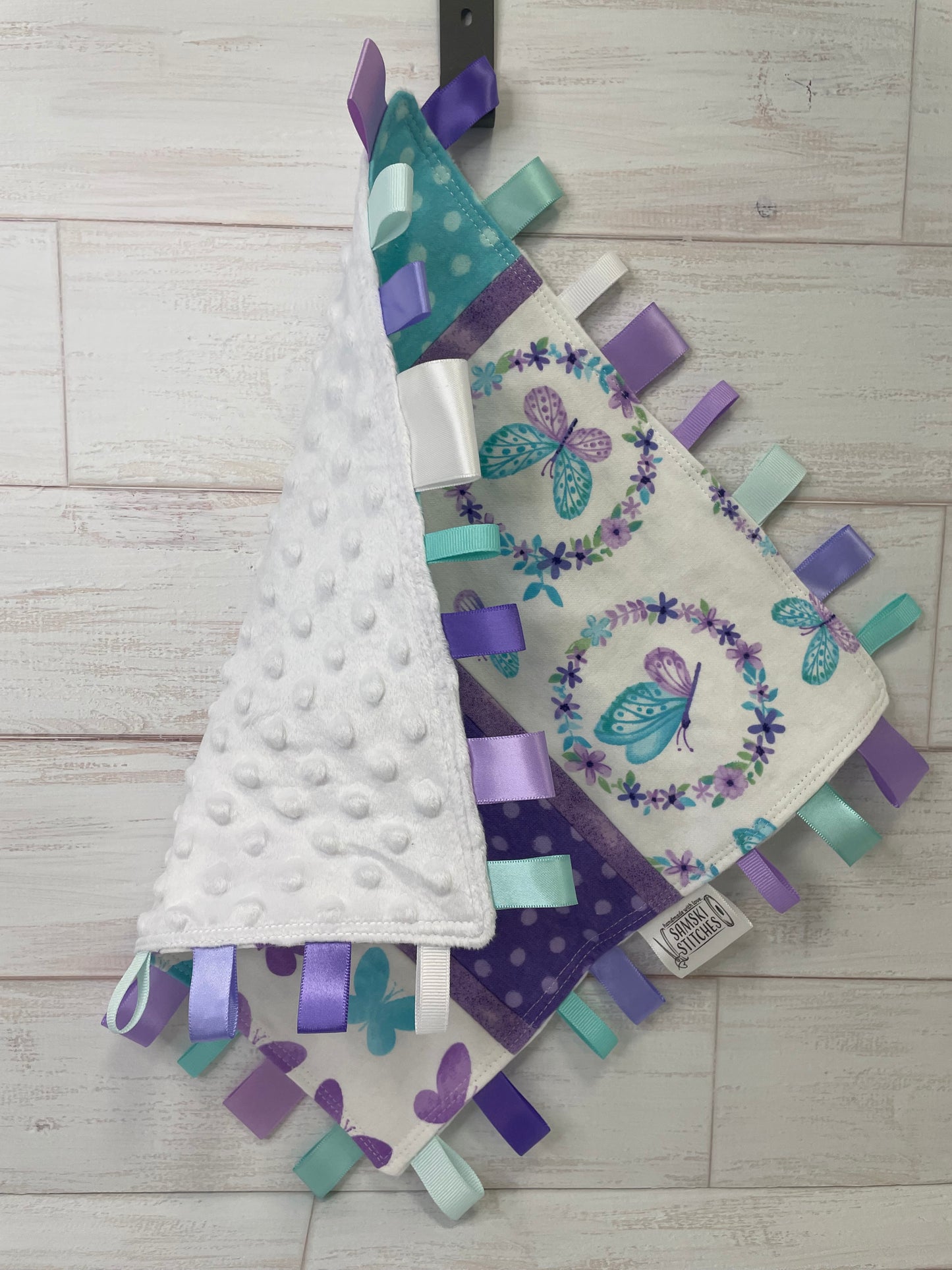 Butterflies on White with Turquoise and Purple Accents Sensory Taglet