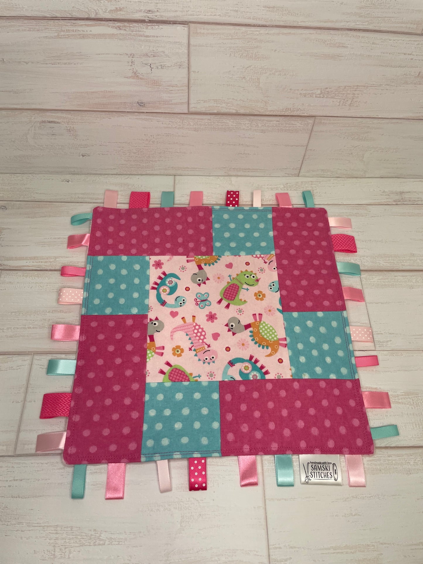 Dinosaurs with Aqua & Pink Dots Sensory Taglet