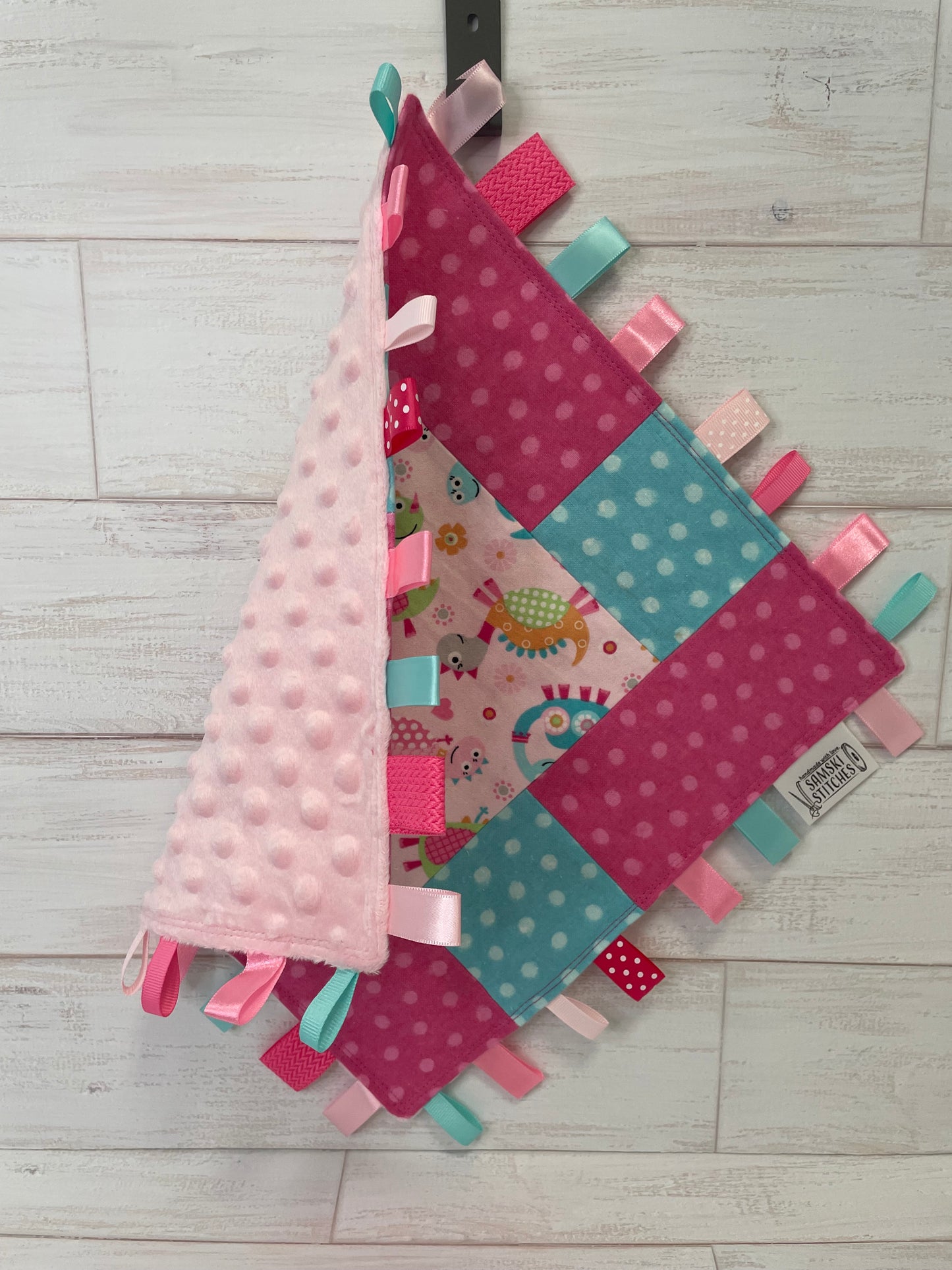 Dinosaurs with Aqua & Pink Dots Sensory Taglet
