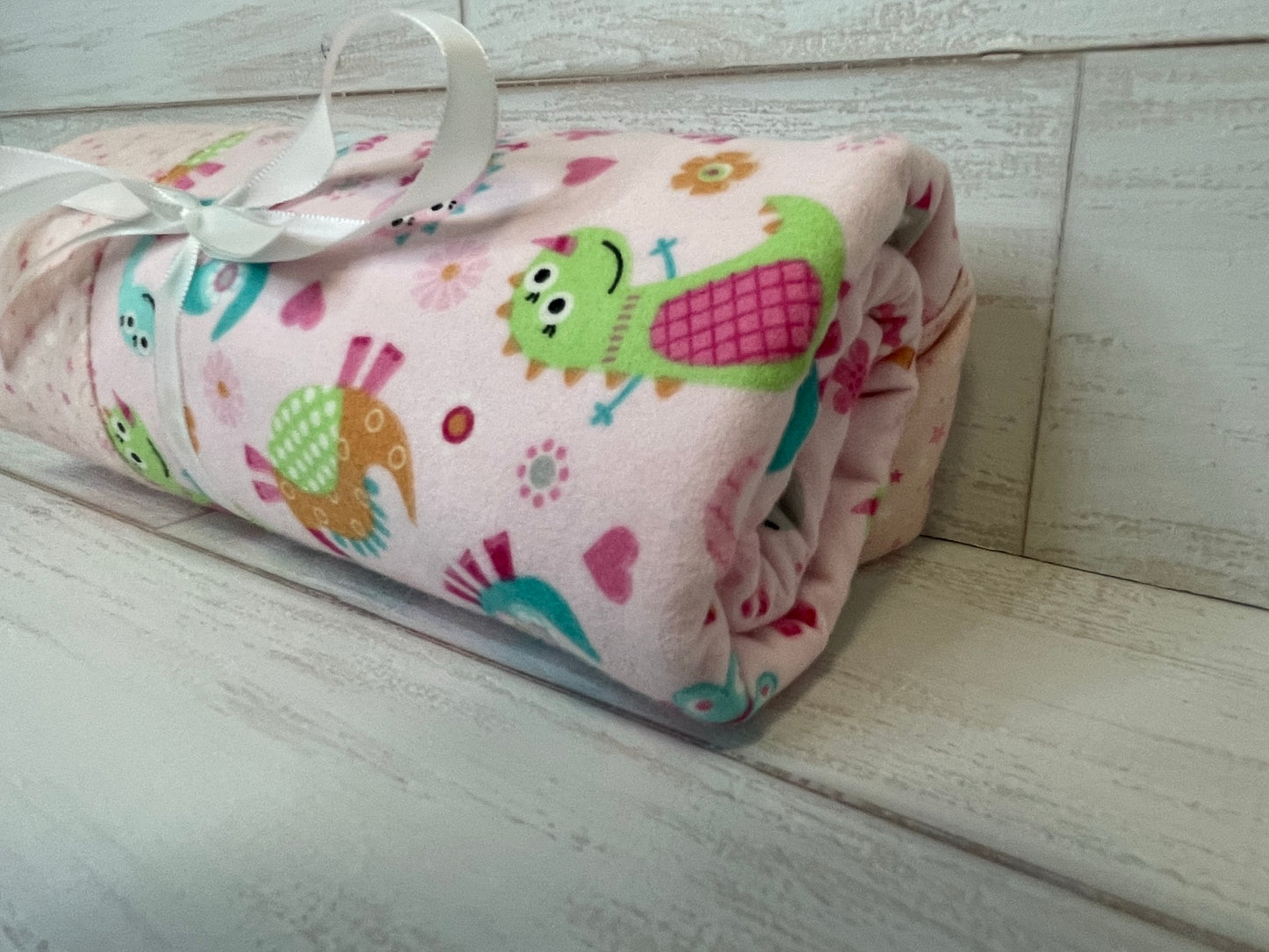 Dinosaurs on Pink with Stars Swaddle Blanket