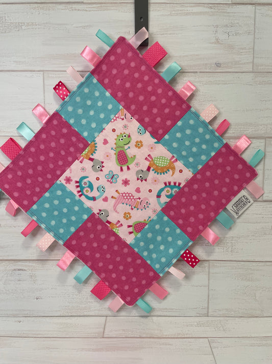 Dinosaurs with Aqua & Pink Dots Sensory Taglet