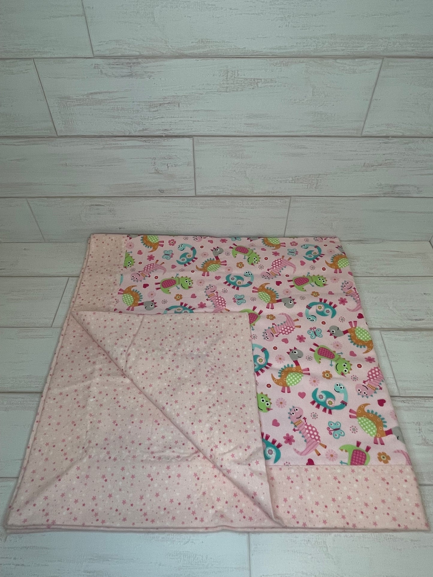 Dinosaurs on Pink with Stars Swaddle Blanket