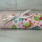 Dinosaurs on Pink with Stars Swaddle Blanket